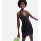 Go Get Them Tall Black Halter Mini Dress