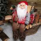33cm Sitting Father Christmas Santa Claus Figurine Holding Skis and Sack